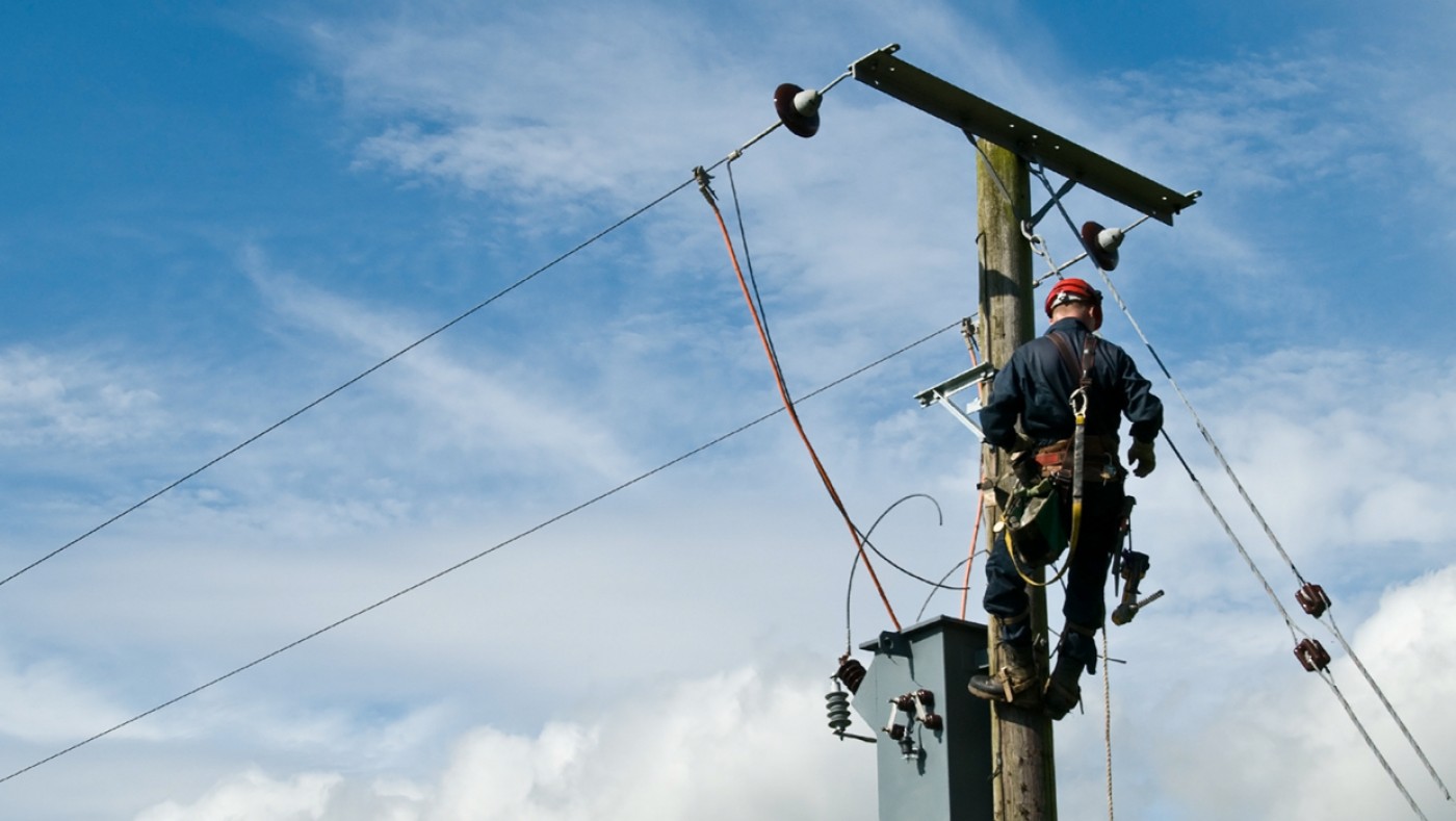 Electrician repairing power lines