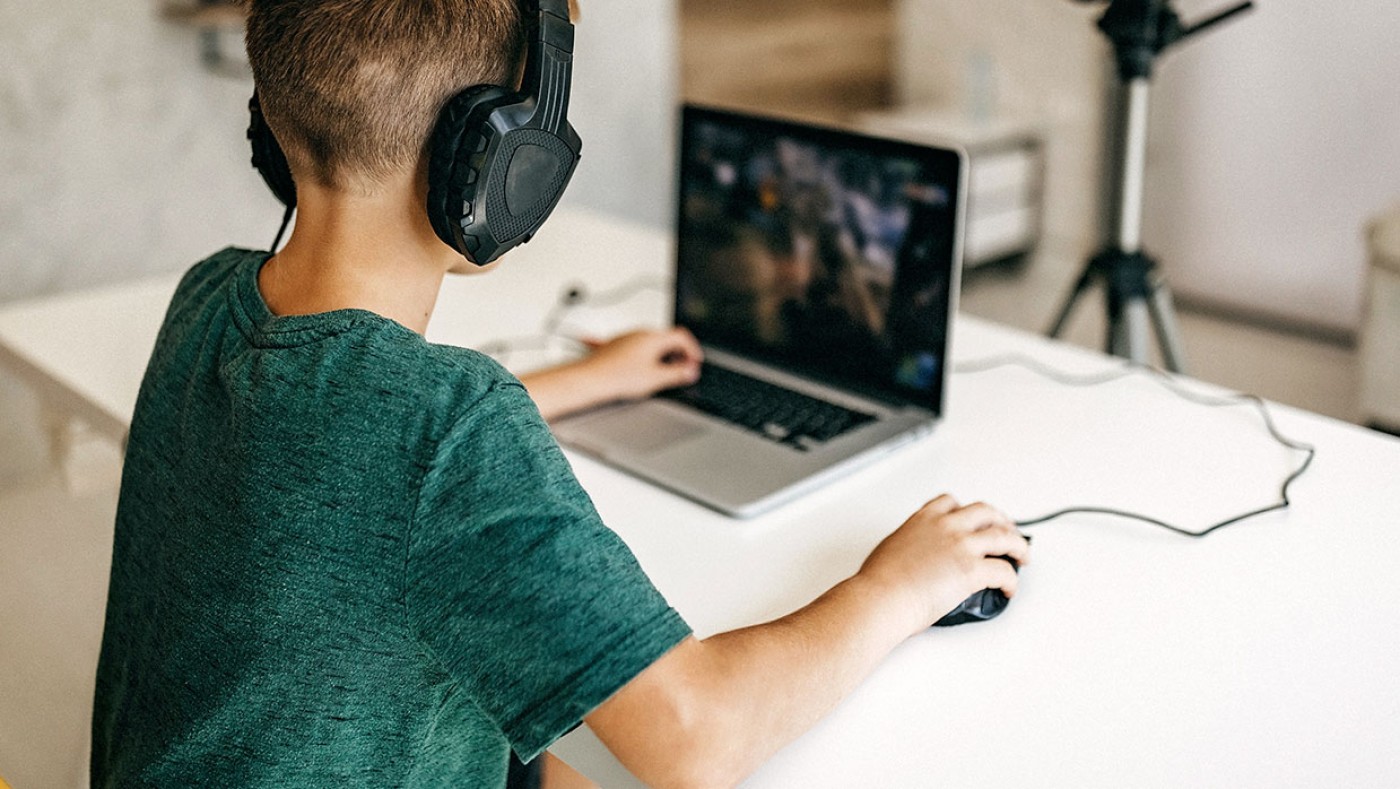 boy gaming on a laptop