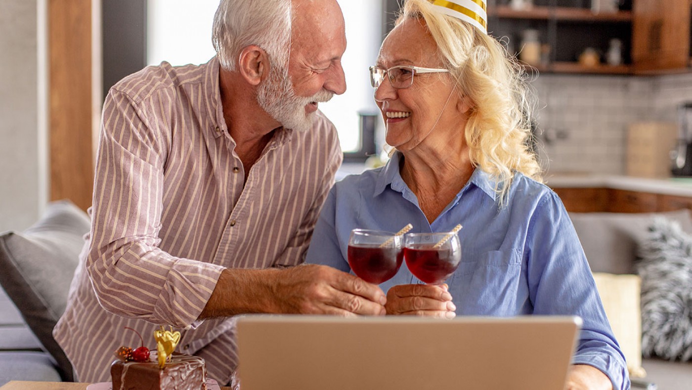 older couple celebrating with a virtual party