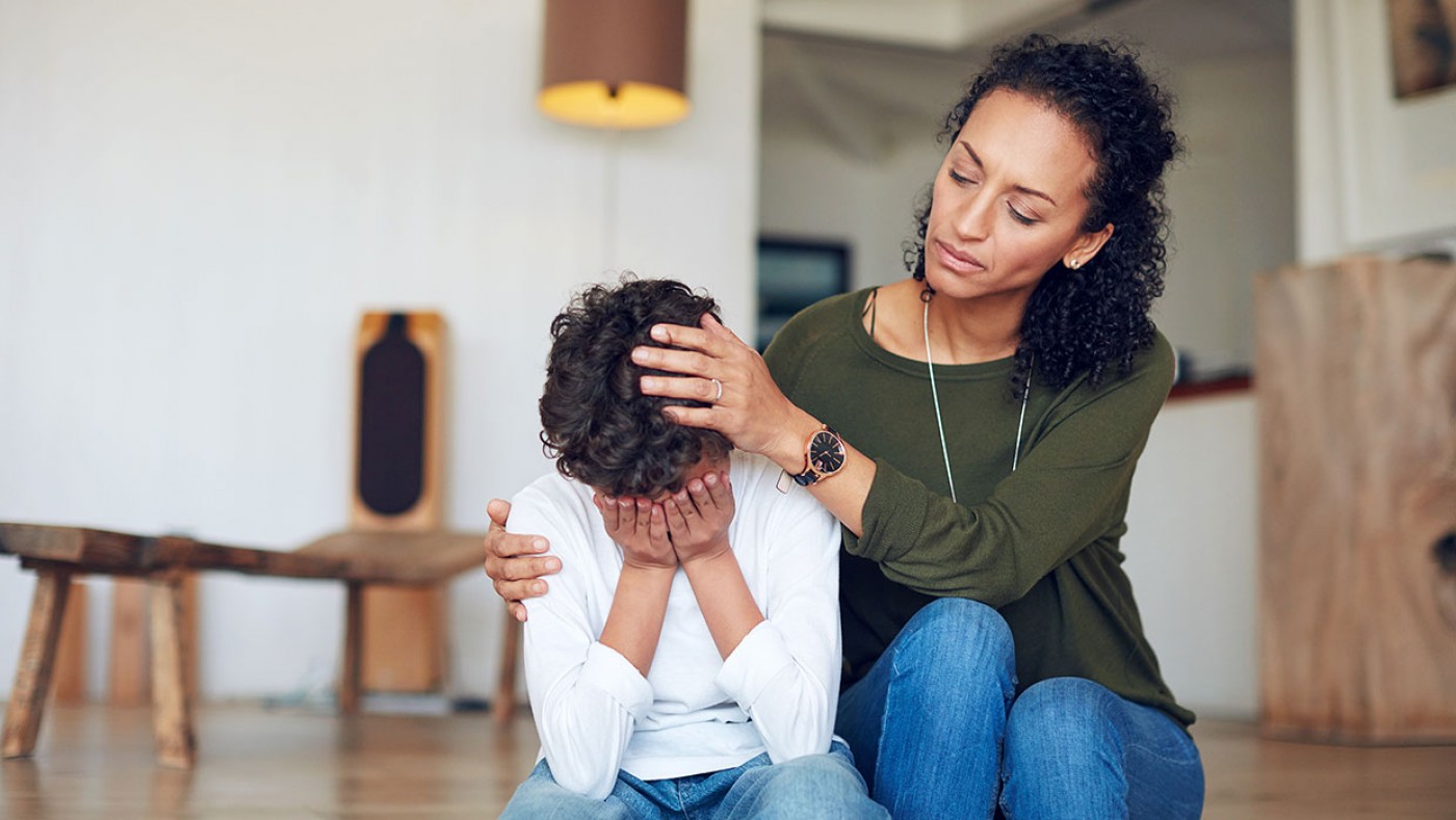 mom consoling young son