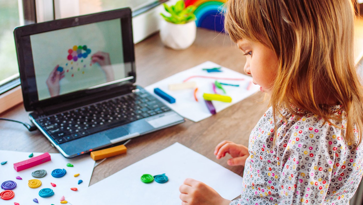 child working on an art project at home