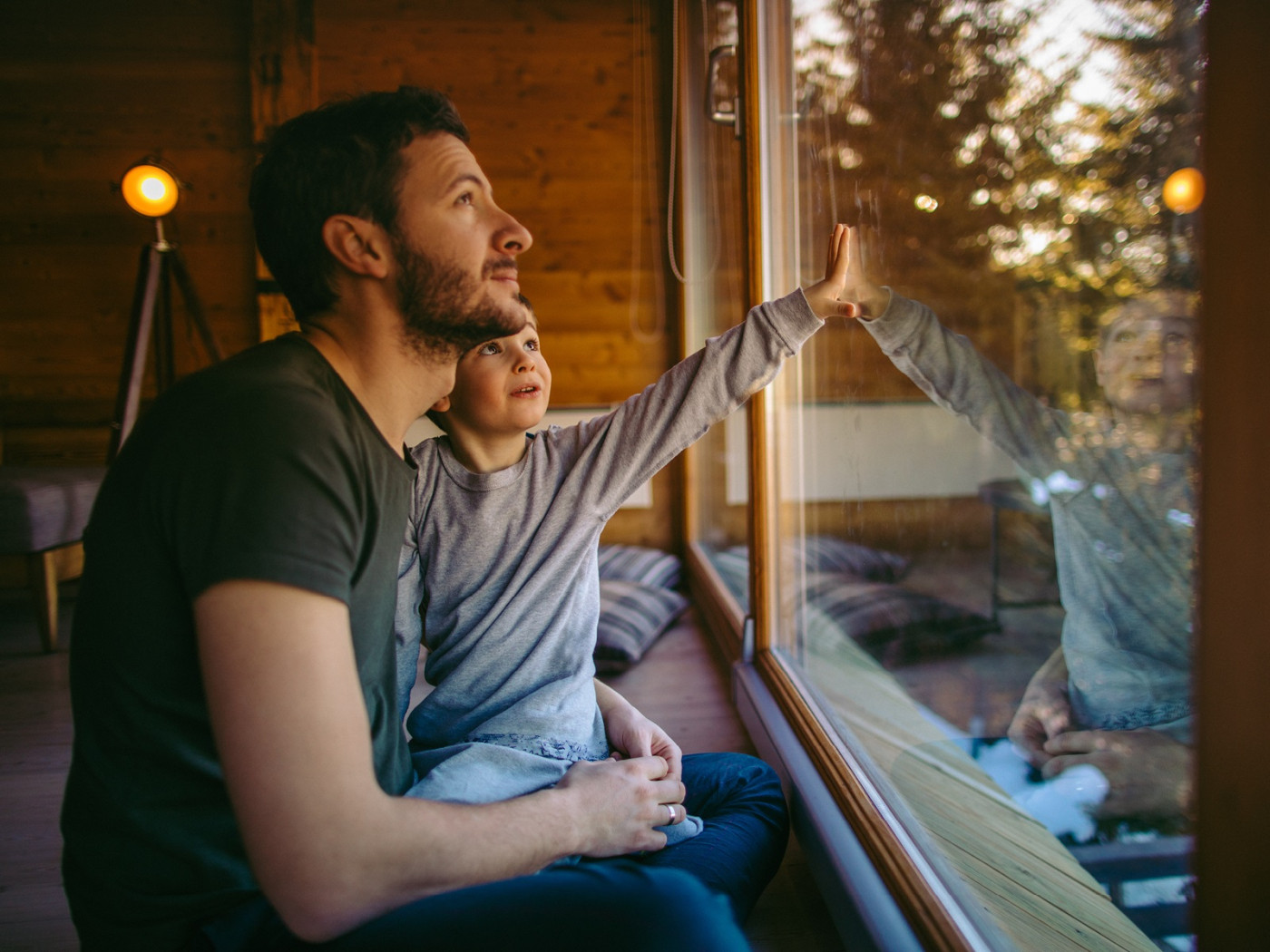 Father and Son looking out window